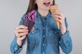 I eat too much high calories food concept. Cropped closeup photo portrait of pretty girl holding two nice looking tasty delicious