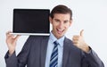 I endorse this. A young businessman endorsing a laptop with a thumbs up. Royalty Free Stock Photo