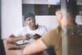 I always enjoy our talks. two young men talking while having coffee together in a cafe. Royalty Free Stock Photo