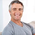 I am enjoying my life. Headshot portrait of a handsome mature man smiling while looking at the camera during the day. Royalty Free Stock Photo