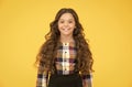 I feel beautiful today. Beauty look of little schoolchild. Happy girl with school look. Small kid wear uniform yellow Royalty Free Stock Photo