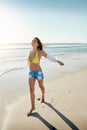 I feel so free at the beach. a beautiful young woman enjoying her day at the beach. Royalty Free Stock Photo