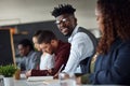 I feel so fulfilled to be a part of the team. Portrait of a young businessman working alongside his colleagues in an Royalty Free Stock Photo