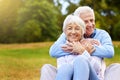 I feel happiest in his arms. Portrait of a senior couple enjoying the day together in a park. Royalty Free Stock Photo