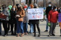 I am feminist, and you - girl holds poster in Russian. Rally for women rights on International Women Day March 8, feminism on