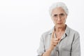 I forbid you. Portrait of strict and serious disappointed granny with white hair in glasses frowning with mad expression