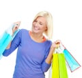 I got the best deals today. An excited young woman holding shopping bags while isolated on a white background.