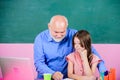 I got school spirit. small girl with man tutor study on laptop. senior teacher help school girl. online education. Back Royalty Free Stock Photo