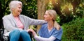 I am grateful to have you. a cheerful elderly woman in a wheelchair spending time with her daughter outside in a park. Royalty Free Stock Photo