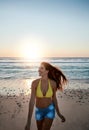 I had my dos of vitamin sea. a beautiful young woman enjoying herself at the beach at sunset. Royalty Free Stock Photo