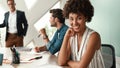 I am happy to work here Young afro american woman is looking at camera and smiling while her boss standing near Royalty Free Stock Photo