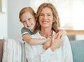 I have the best grandmother ever. an adorable little girl hugging her grandmother during a day at home. Royalty Free Stock Photo