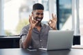 I have everything under control on my side. a young businessman making an okay sign during a video call on a laptop in Royalty Free Stock Photo