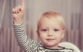 I have excellent idea. Boy cute toddler blue eyes pointing upwards index finger. Creative idea concept. Brilliant Royalty Free Stock Photo