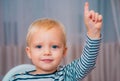 I have excellent idea. Boy cute toddler blue eyes pointing upwards index finger. Creative idea concept. Brilliant Royalty Free Stock Photo