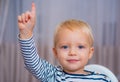 I have excellent idea. Boy cute toddler blue eyes pointing upwards index finger. Creative idea concept. Brilliant Royalty Free Stock Photo