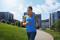 Because I have never finished a run sad. a young woman listening to music while out running. Royalty Free Stock Photo