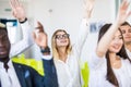 I have a question. Group of people sitting at the chairs in conference hall, raising their hands. Workshop at university. Business Royalty Free Stock Photo