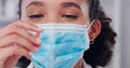 I hope this cure works. a young scientist holding a pill in her hand while working in a lab. Royalty Free Stock Photo