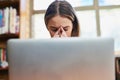 I hope I can memorize all this information. a young woman looking stressed while sitting behind a laptop. Royalty Free Stock Photo