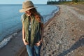 I just cant resist the outdoors. an attractive young woman enjoying a walk by the lake.