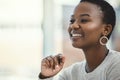 I just got the best idea. a young businesswoman smiling while sitting at her desk. Royalty Free Stock Photo