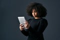 I just got an exciting business deal. a young businesswoman using a digital tablet against a studio background. Royalty Free Stock Photo