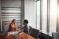 I just know well become great business partners. two businesswoman shaking hands in an office.