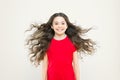 I just let my hair go. Happy child with flowing hair on yellow background. Little kid with cute smile and wavy textured Royalty Free Stock Photo