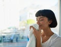 I just love the smell of clean laundry. a young woman smelling freshly washed towels at home. Royalty Free Stock Photo