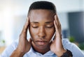 I just need to focus thats all. a young and stressed businessman suffering from a headache while trying to work in the Royalty Free Stock Photo