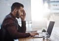 I just need to get through the day. a young businessman looking stressed out while working in an office. Royalty Free Stock Photo