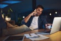 I just submitted it and Im sure theyll be impressed. a handsome young businessman talking on his cellphone while sitting Royalty Free Stock Photo