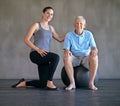 I keep my patients feeling young and spritely. a a physical therapist working with a senior man.