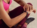 I keep track of every step I take. Crossed shot of an unrecognizable woman using a smartwatch while out exercising. Royalty Free Stock Photo