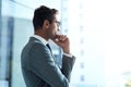 I know exactly where I want my business to go. a professional businessman looking thoughtful while standing in his