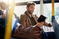 I know just where Im going next. a handsome young man reading a book during his morning bus commute. Royalty Free Stock Photo