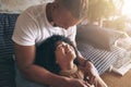 I know what love is because of you. a young couple relaxing together at home.