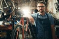 I know whats best for your bike. Portrait of a mature man working in a bicycle repair shop.