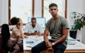 I know where I stand in this business. Portrait of a confident young businessman with his team having a meeting in the Royalty Free Stock Photo