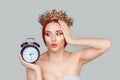 I am late. Portrait of young surprised beauty queen woman looking at alarm clock frustrated of being late in rush pretty woman