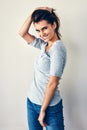 I like expressing myself. Studio shot of an attractive young woman posing against a grey background.