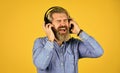 i like it so much. brutal hipster wear earphone. singing and dancing. Enjoying favorite music. Man listen music with his Royalty Free Stock Photo