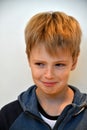 I like pranks, little boy  can hardly stifle his laughter Royalty Free Stock Photo