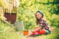 I like spending time on farm. Little helper in garden. Happy little gardener with spring flowers. Happy childhood