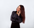 I like voice calling. Happy toothy smiling positive woman with long curly hairstyle in business office clothing Royalty Free Stock Photo