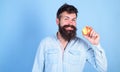 I love apples Man handsome hipster with long beard eating apple. Hipster hungry bites enjoy ripe apple. Fruit healthy