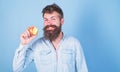 I love apples Man handsome hipster with long beard eating apple. Hipster hungry bites enjoy ripe apple. Fruit healthy