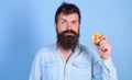 I love apples Man handsome hipster with long beard eating apple. Hipster hungry bites enjoy ripe apple. Man diet