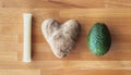 I love avocado or guacamole message spelled out using foods including mozzarella string cheese and a heart shaped potato on a Royalty Free Stock Photo